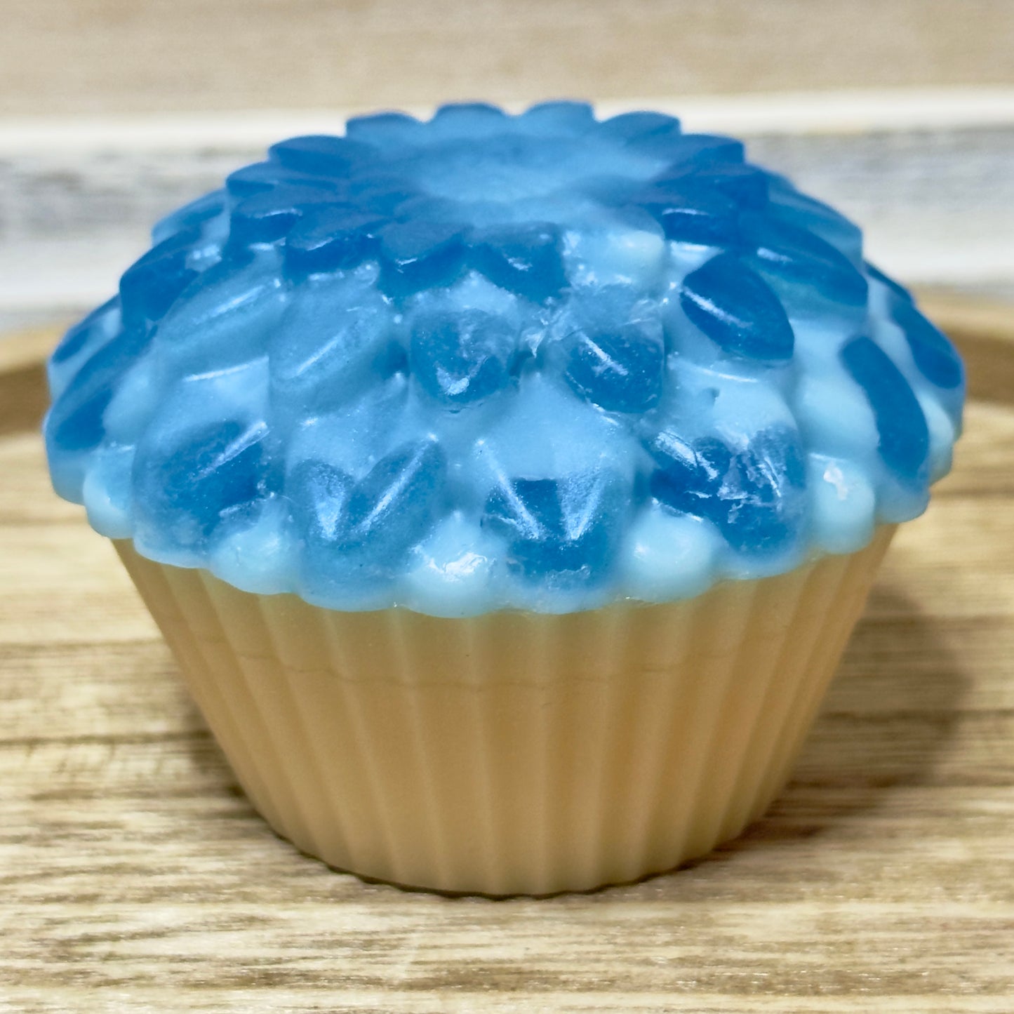 Blue_tansy_vanilla_scented_cupcake_soap_on_wooden_plate