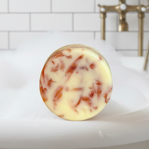 Amber Rouge scented soap bar in a bubble bath