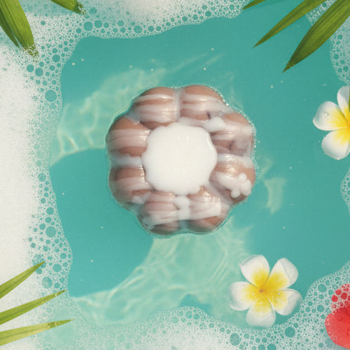 Coconut vanilla Bundt cake soap bar in tropical bubble bath 