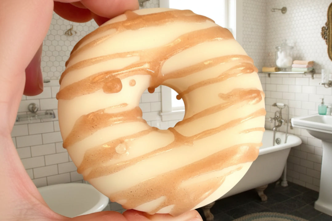 Coconut vanilla scented donut soap with white glaze and brown drizzle