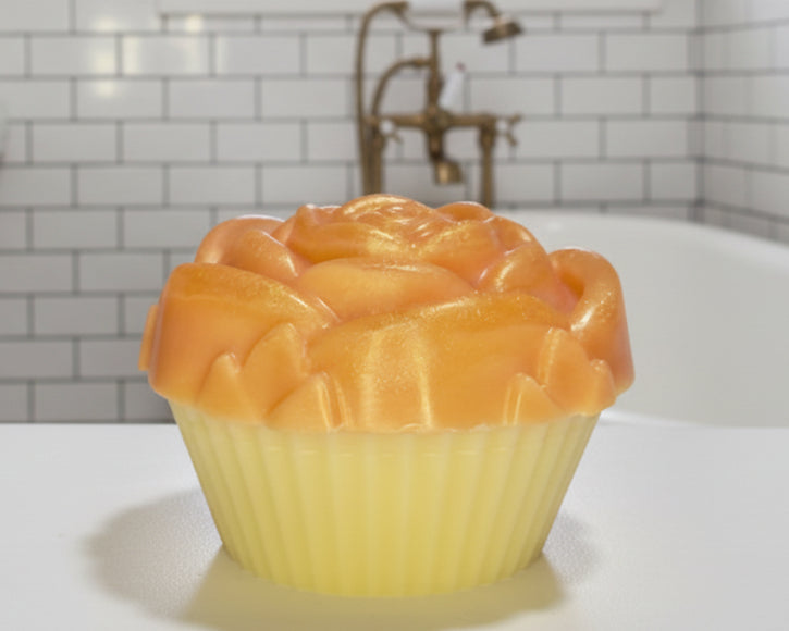 golden blossom cupcake soap bar on the tub